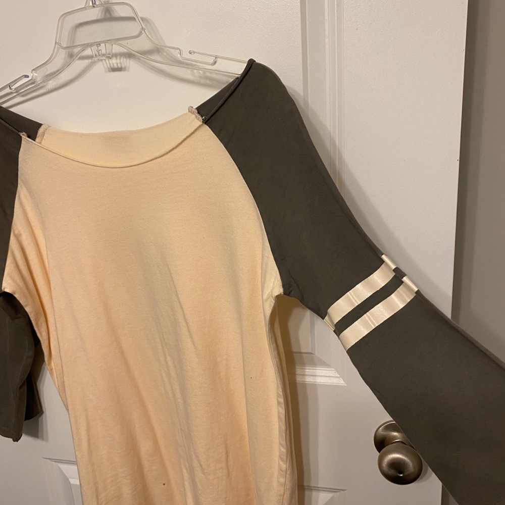POL T with varsity sleeve on one arm